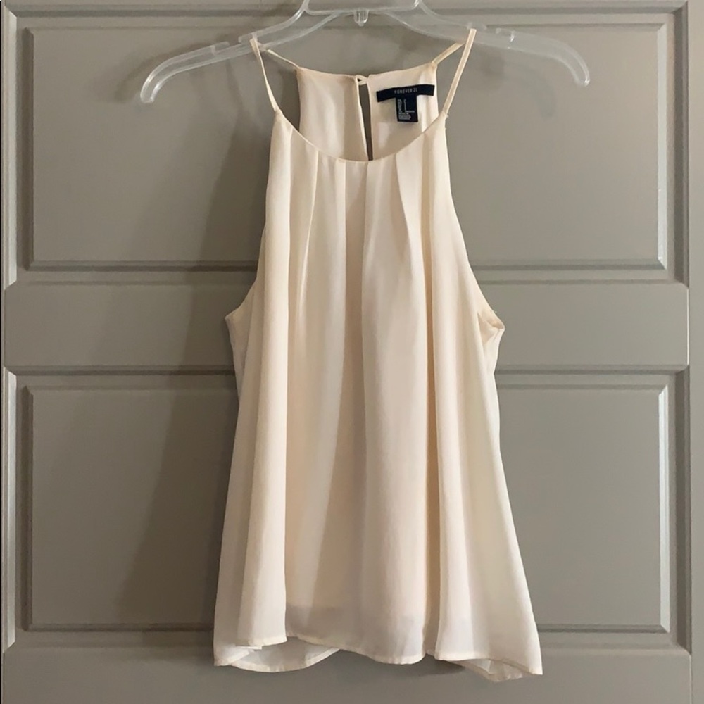 cream flowy tank top.